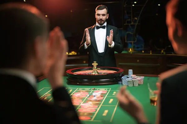 JILIHH Casino — Step inside our high-end casino experience A glamorous woman holding casino chips in a neon-lit environment, representing the premium online casino atmosphere of JILIHH.