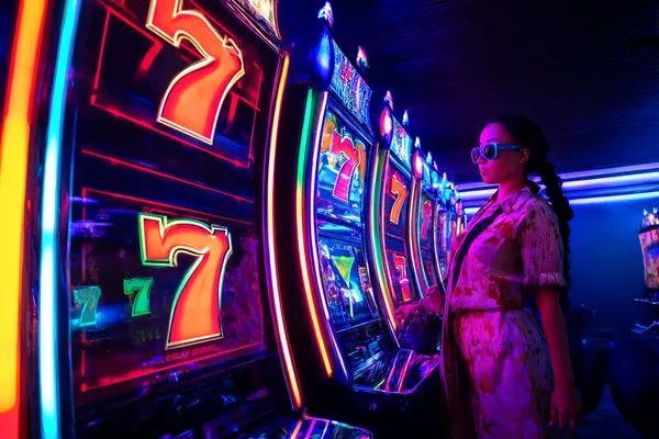 JILIHH Member Login — Return to your personalized dashboard A person using their device against a moody casino-themed background, illustrating the smooth re-entry process at JILIHH.